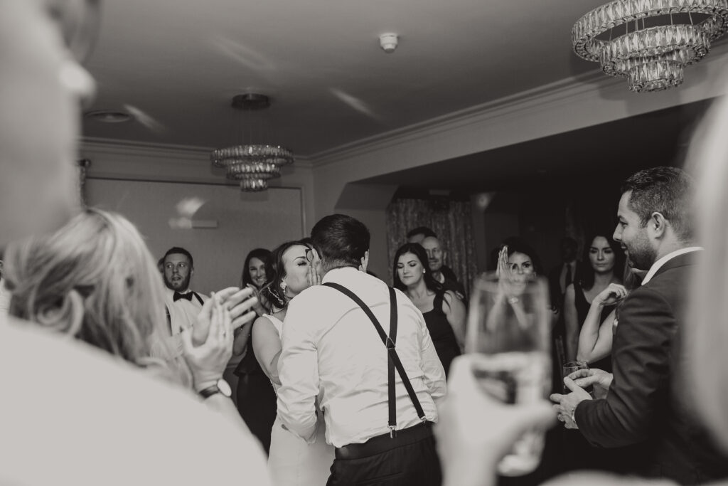 Bride and groom kissing during their first dance at Cheshire Wedding