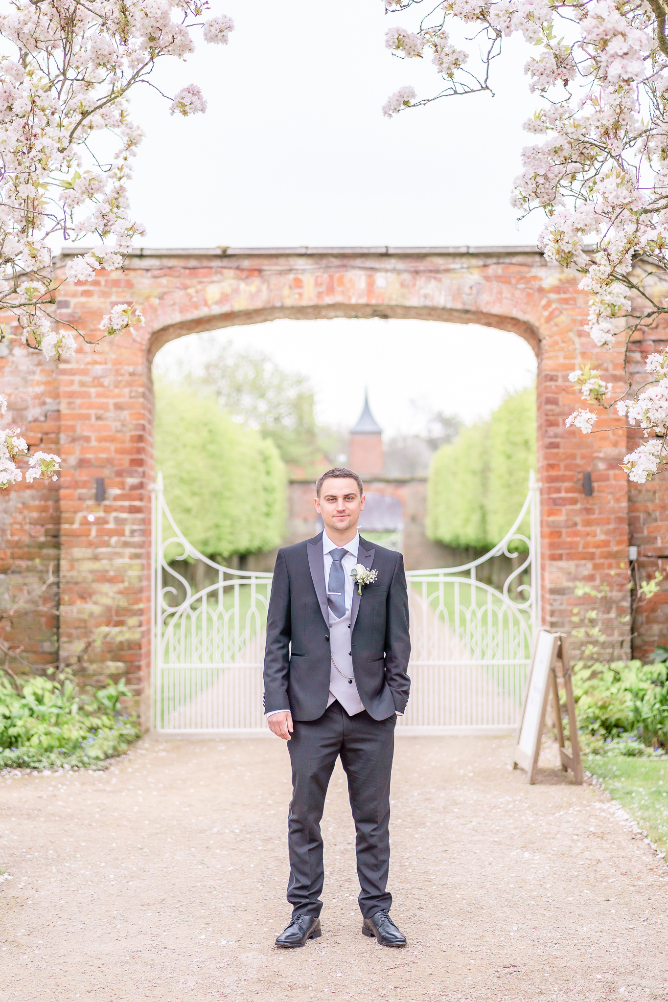 Groom on his own in the grounds at North West wedding venue, Combermere Abbey