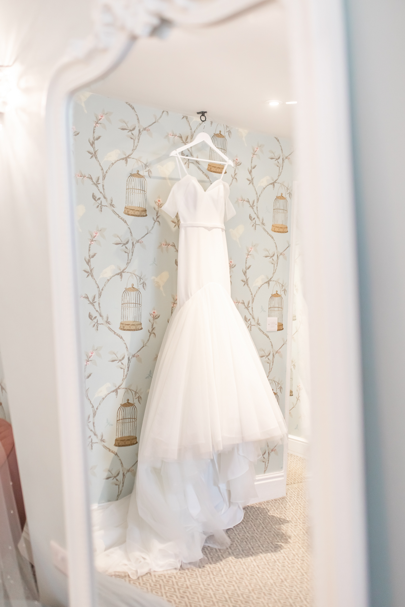 A reflection of the brides dressing hanging in Combermere Abbey bridal prep room