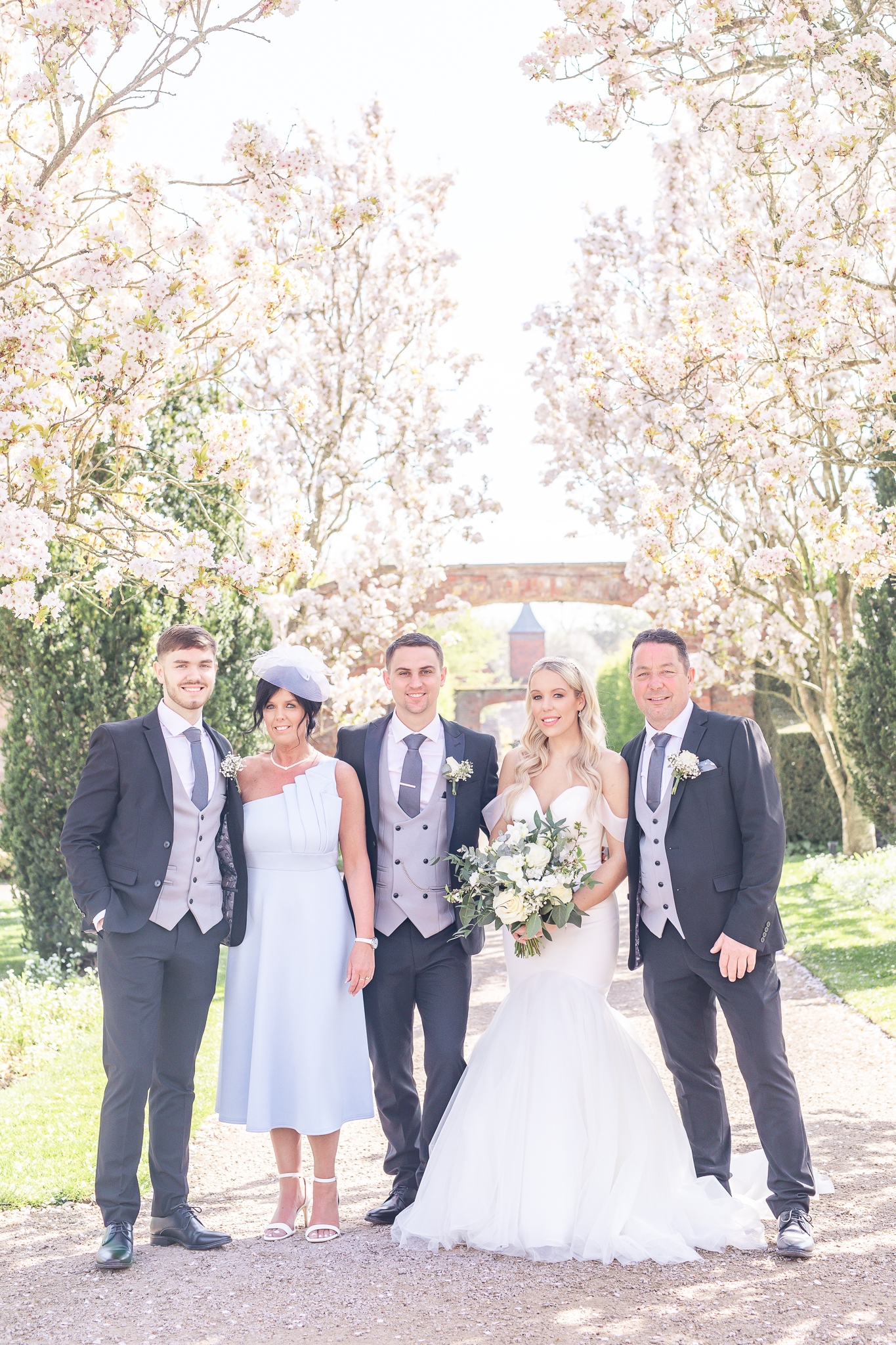 Family portraits in the gardens at Combermere Abbey, Cheshire wedding venue