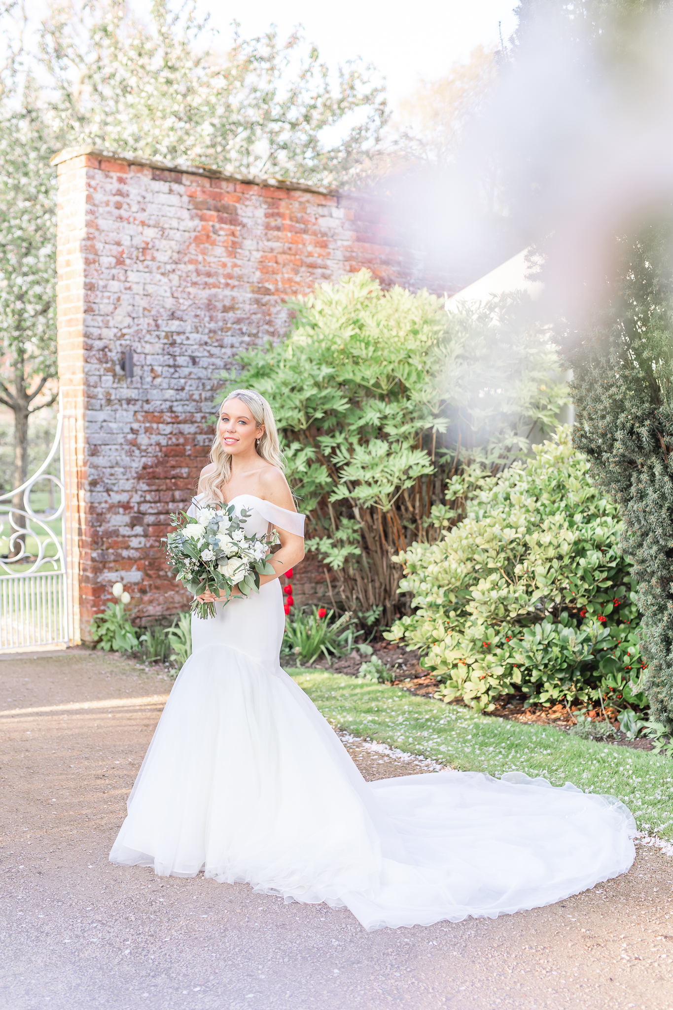 Bridal portrait of bride Kelsey in the gardens at Combermere Abbey