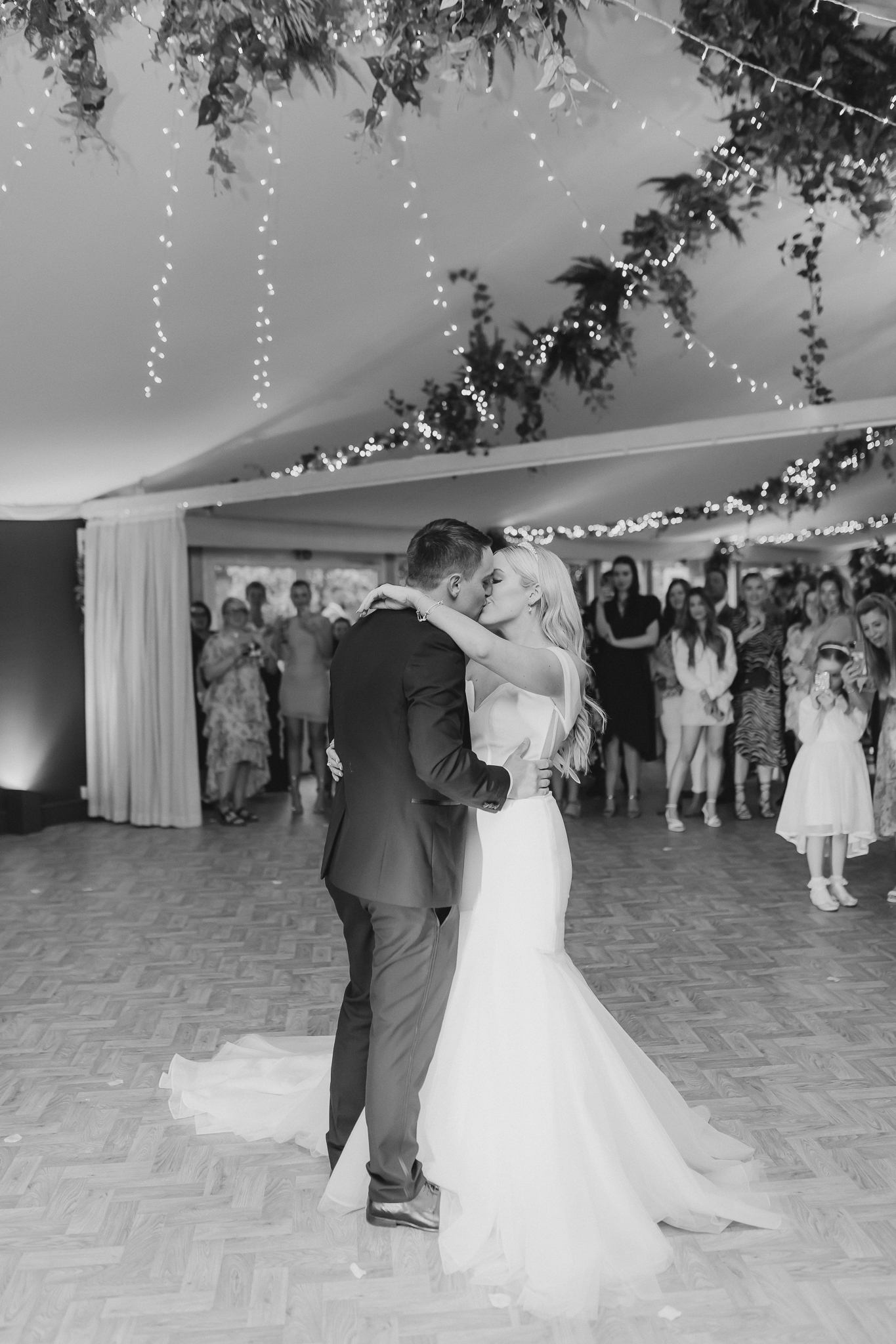 Kelsey and Spencer sharing a kiss during their first dance at Cheshire wedding venue Combermere Abbey