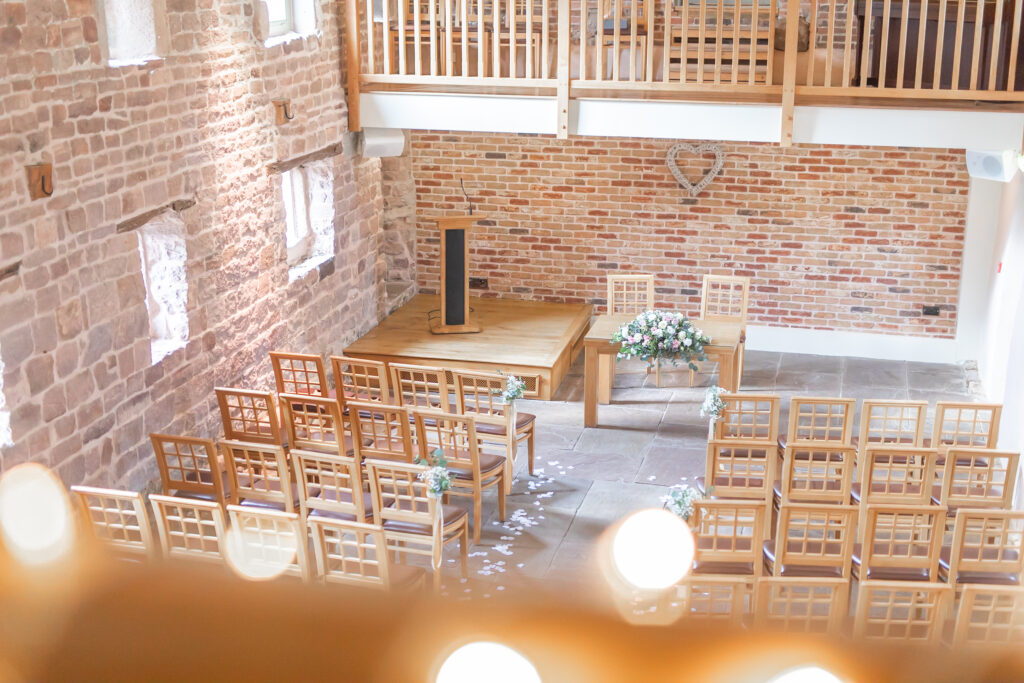 Light and airy ceremony room at The Ashes wedding barns in Staffordshire