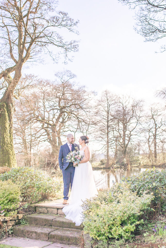 A couple sharing a tender moment at The Ashes Wedding Barn Venue in Staffordshire, captured by Cheshire wedding photographer, Sophie Siddons