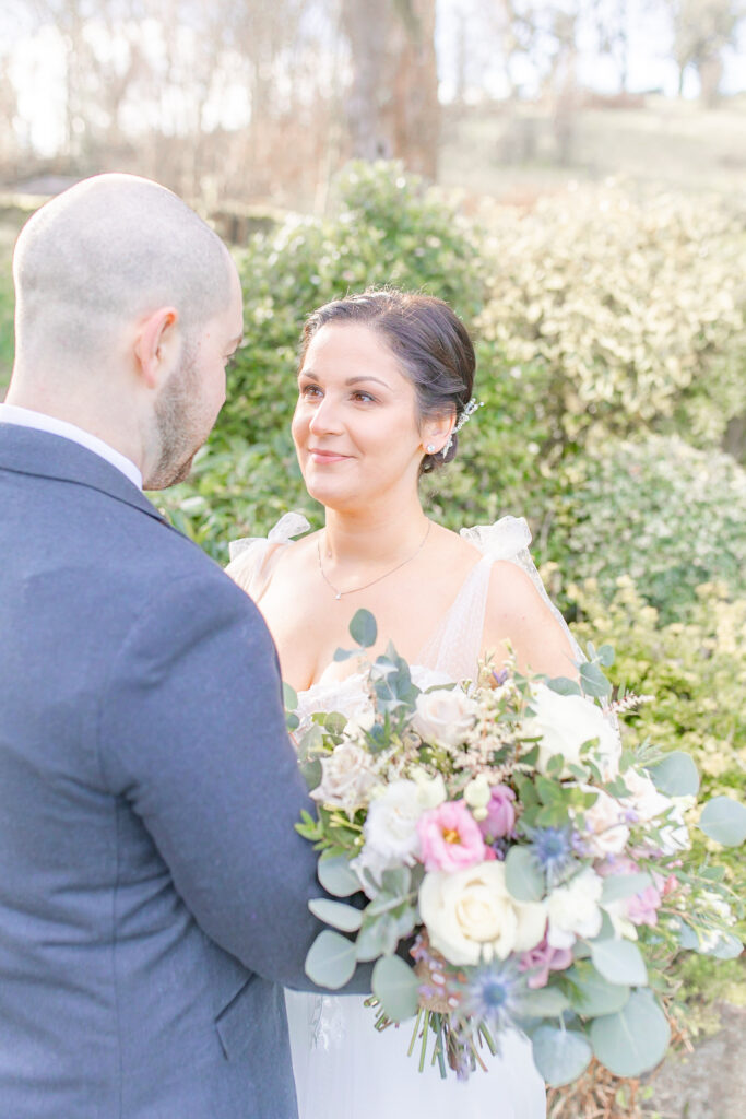 Bride looking into her grooms eyes in the grounds at The Ashes Wedding venue in Staffordshire, taken by North West wedding photographer, Sophie Siddons