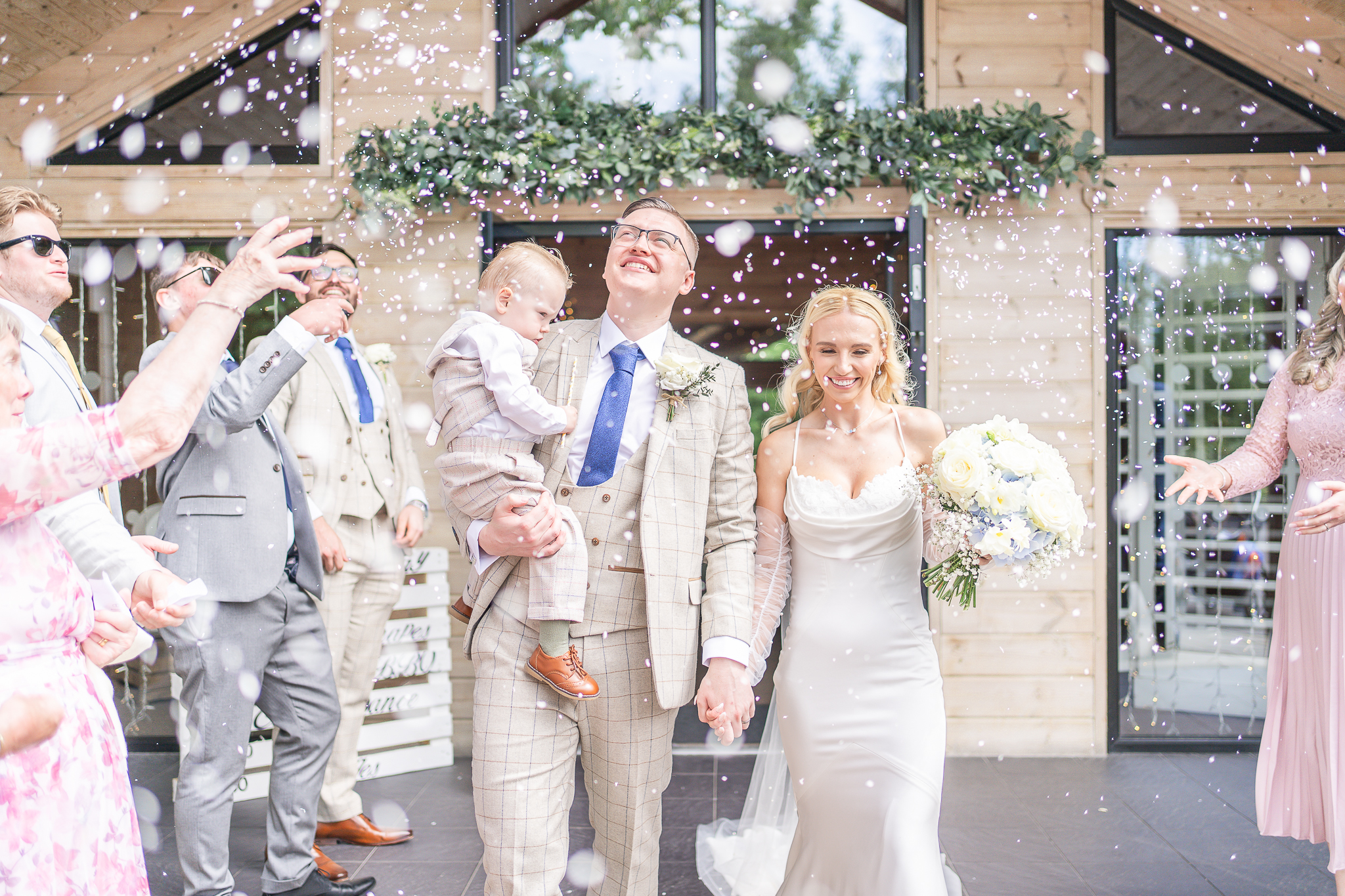 Bride and groom during confetti walk