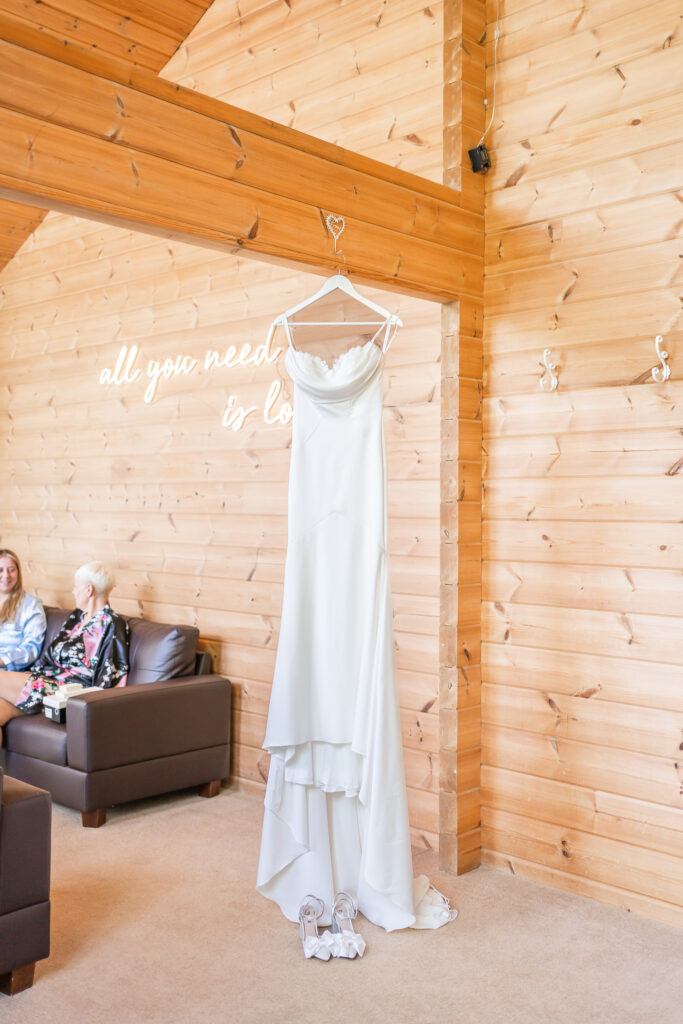 Wedding dress hanging at Styal Lodge bridal prep room